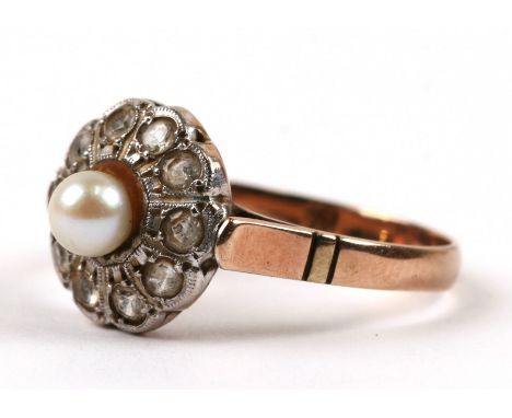 An Edwardian yellow metal dress ring set with a central pearl, approx UK size 'O'.Condition Reportno hallmark, pearl not scra