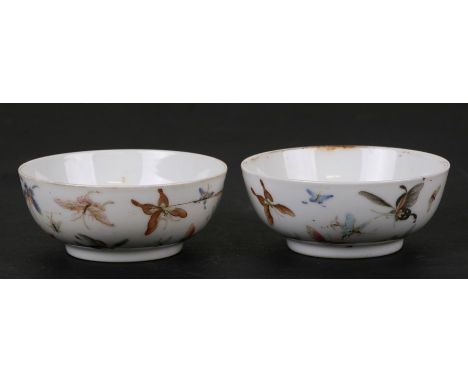 A pair of Chinese porcelain wine cups decorated with butterflies, four character red mark to the underside, 8cms (3.1ins) dia