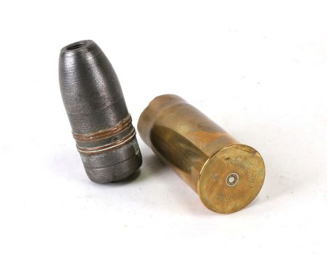 A complete inert WW1 artillery shell and brass casing in two parts. Date stamp to the base for 2. 16. (February 1916). Diamet