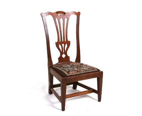 An early 20th century Scottish miniature Chippendale style child's chair by Wheeler of Arncroach, with pierced vase shaped ba