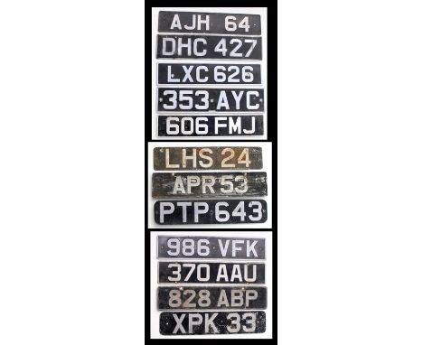 A collection of vintage aluminium number plates for display purposes only
