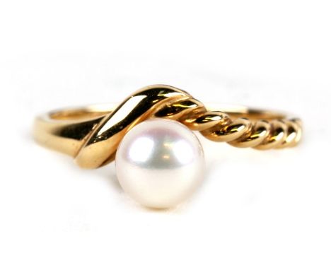 An 18ct gold ring set with a single pearl, approx UK size 'N'.Condition Reporthallmarked, good overall condition no scratches