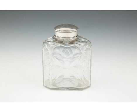 A RARE GEORGE III CUT GLASS TEA CADDY, fitted with silvered collar and cover, engraved with crest, 13cm high