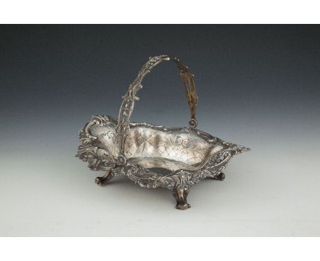 AN AMERICAN SILVER SWING HANDLED BASKET IN THE ROCOCO STYLE,  stamped 'STERLING' and 'TIFFANY & CO.', the pierced handle with