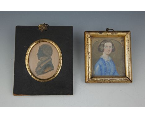 A VICTORIAN MINIATURE PORTRAIT OF A LADY IN A BLUE DRESS; together with a 19th century silhouette of a gentleman in ebonised 