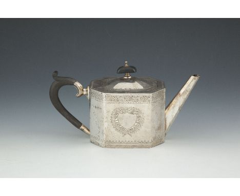 A GEORGIAN REVIVAL BRIGHT CUT SILVER TEAPOT, Birmingham 1923, of octagonal form, with hinged cover and ebonised finial, decor