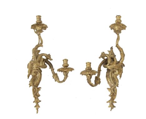 A PAIR OF CAST GILT BRASS TWO BRANCH WALL SCONCES, each of scrolling form, decorated with foliate design, central dragon head