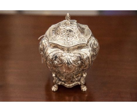 A VICTORIAN SILVER TEA CADDY, Chester 1896, mark of George Nathan & Ridley Hayes, of bombe form, the hinged lid decorated wit