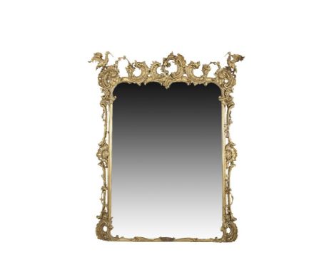 A FINE LATE GEORGE III CARVED GILTWOOD SHAPED RECTANGULAR OVERMANTLE MIRROR, in the manner of Thomas Chippendale, the openwor