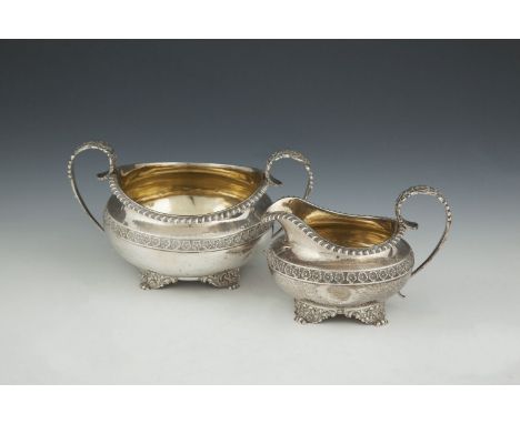 A REGENCY THREE PIECE SILVER TEA SERVICE, London 1819, makers mark of Joseph Craddock & William Reid, of circular baluster fo