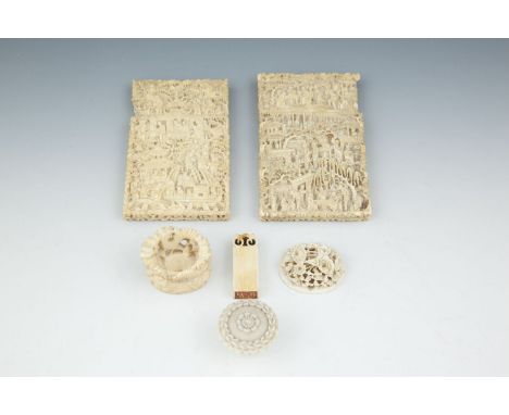 A COLLECTION OF CHINESE IVORIES, 19th century, comprising a pair of Cantonese card cases, 11.5cm, a carved oval stand decorat