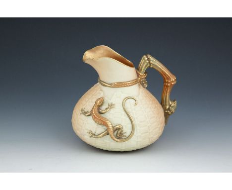 A ROYAL WORCESTER PORCELAIN BLUSH BASKET-WEAVE 'LIZARD JUG', of circular baluster form, with tied twig handle and decorated w