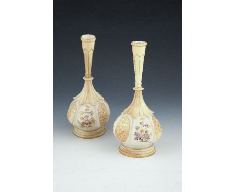 A PAIR OF ROYAL WORCESTER PORCELAIN BLUSH LOBED CIRCULAR BALUSTER VASES, with slender necks, the panels decorated with moulde