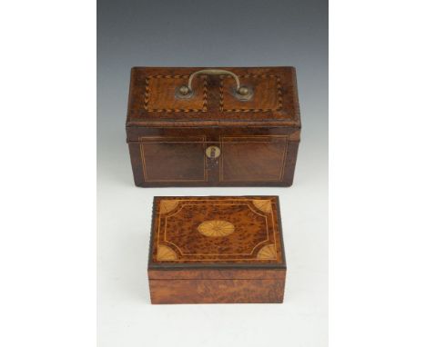 A GEORGIAN STYLE WALNUT AND HERRINGBONE INLAID TEA CADDY, of rectangular form, with brass bracket handle and compartmented in