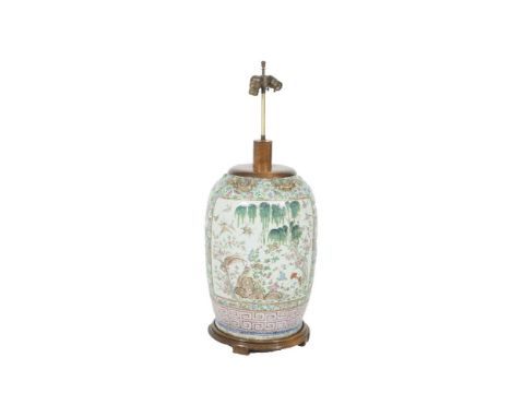 A LARGE CHINESE FAMILE VERT PORCELAIN URN, converted to a lamp, decorated profusely with foliate designs to represent a garde