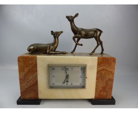 Art Deco mantle clock with bronzed deer to top.  Pendulum in office