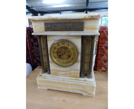 Architectural marble mantle clock with brass repousse plaque and columns
