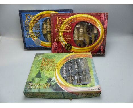 Three chess sets, boxed Lord of the Rings.