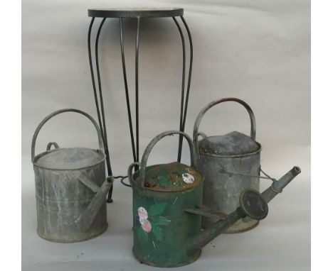 Three tin watering cans, one with rose and decorated with painted flowers 38cmH and two others 40cmH, together with a ceramic