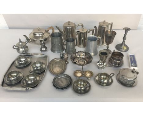 A quantity of silver plated and pewter items including a tankard, tea pot, coffee pot, chocolate pot, sugar bowls, caster, ca