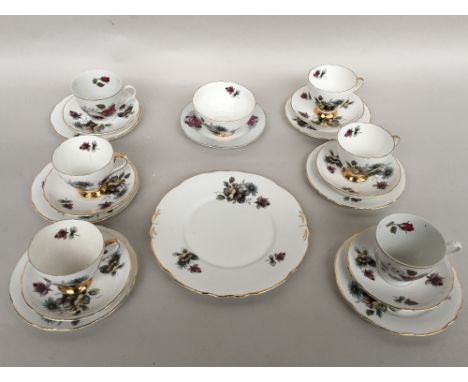 A fine bone china part tea service from Royal Ascot cream ground with floral spray heightened in 22 carat gold to included te