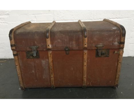 A canvas and wooden bound cabin trunk with leather handles to side 47x77x50cm 
