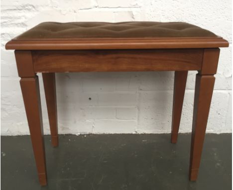 A double piano stool with button back light brown upholstered seat on square tapered legs