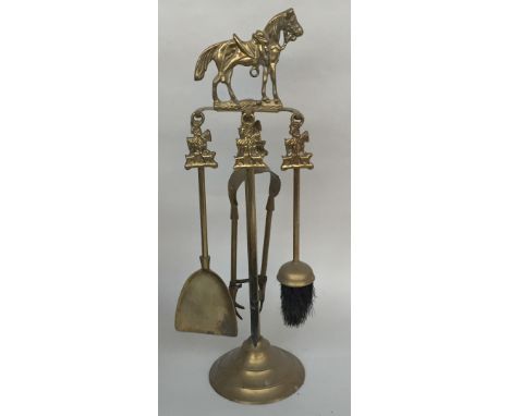 A brass fire companion with horse finial together with a lidded copper coal storage bucket