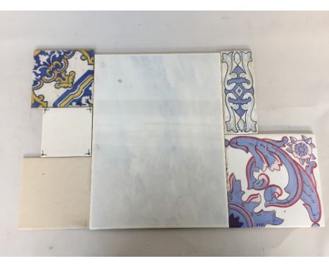 A box of continental ceramic tiles various patterns and sizes together with some plain wall tiles