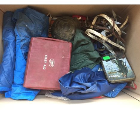 Vintage camping equipment to include a tent, a first aid kit, water bottles, candle cookers, a pump, ice cleats and an "Optim