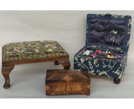 A tapestry footstool raised on stub cabriole legs 33x44x20 cm together with a fabric covered sewing box with removable tray 2