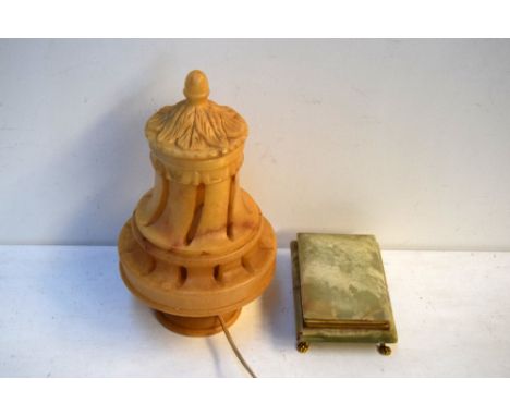 An alabaster trinket box and cover with metal claw feet together with a soapstone electic table lamp of carved foliate design