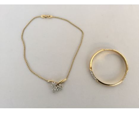 A small set of jewellery by Ciro to include a yellow metal necklace with three flowers made of zirconia with a yellow metal b