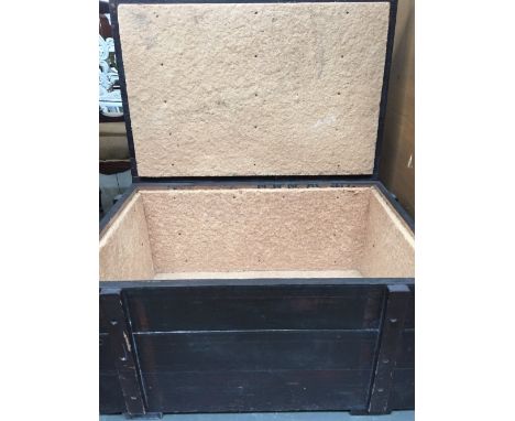 A stained wood rectangular trunk lined with cork board with hinged lid 77 x 49 x 38cm