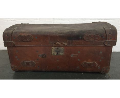 A vintage leather travelling trunk with leather handles bearing various labels such as Red Star Line 54 x 97 x 46cm 