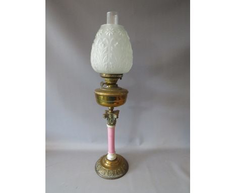A VICTORIAN BRASS AND CERAMIC OIL LAMP, with moulded opaque decorative glass shade, approx overall H 73 cm