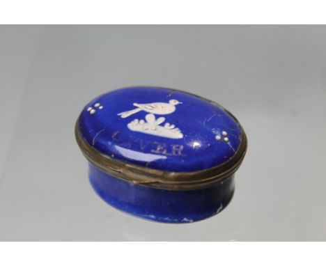 A 19TH CENTURY BLUE ENAMEL PATCH BOX, the hinged lid decorated with a single white bird and 'E Neen the Giver' ?, opening to 