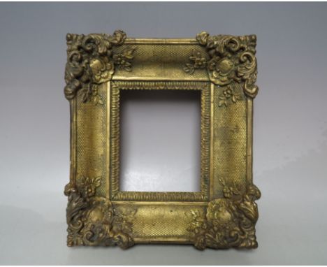 A 19TH CENTURY GOLD SWEPT MINIATURE PORTRAIT FRAME, frame W 6 cm, rebate 14 x 12 cm