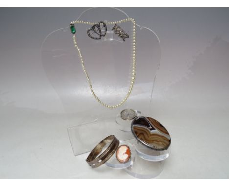 A COLLECTION OF SILVER AND WHITE METAL VINTAGE COSTUME JEWELLERY, to include a Sterling silver buckle bangle, a selection of 