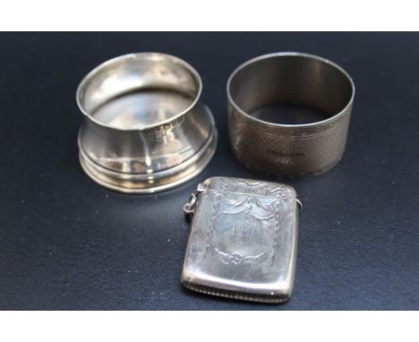 A HALLMARKED SILVER VESTA - BIRMINGHAM 1914, together with a small hallmarked silver pot and a hallmarked silver napkin ring 