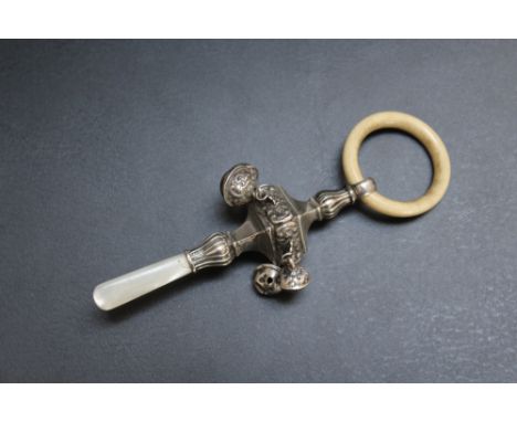 A HALLMARKED SILVER BABY'S BELL RATTLE TEETHER - BIRMINGHAM 1915, with mother of pearl handle, ivory teether ring and four be