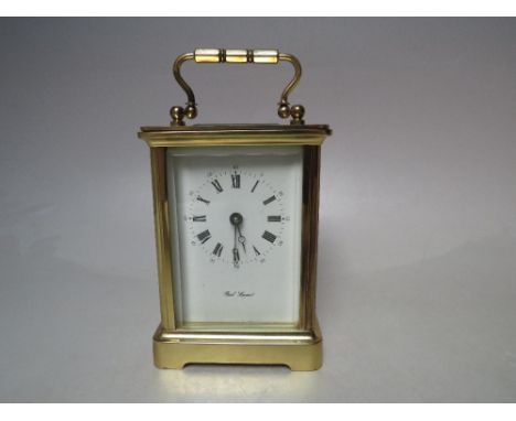 A PAUL LAVANT FRENCH BRASS CASED CARRIAGE CLOCK, the enamel face with Roman numerals and outer minute markers, the movement w