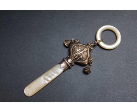 A HALLMARKED SILVER BABY'S 'BOY BLUE' TEETHER RATTLE - BIRMINGHAM 1935, with two bells and mother of pearl handle and teether