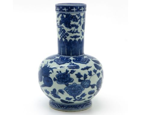 Depicting flowers and Chinese symbols, marked on bottom with double ring and 6 characters, 21 cm. tall.