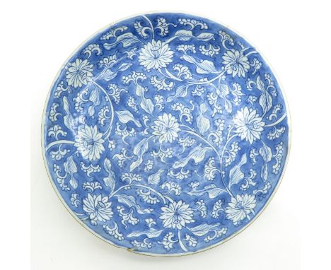 Floral decor, marked on bottom with double ring, 39 cm. in diameter, chip, scratches in glaze.