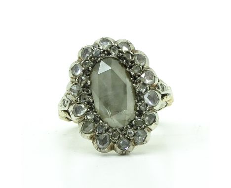 Largest diamond is approximately 14 x 8 mm.  Ring size 16.