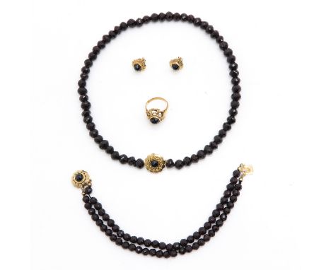 Including necklace, bracelet, ring and earrings, all set in 14 KG.