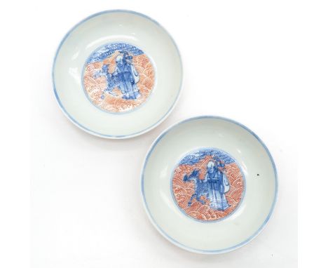 In orange and blue decor, depicting Chinese man with reindeer, marked on bottom with seal mark, 11 cm. in diameter.