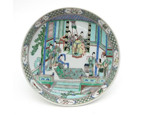 Depicting gathering of Chinese women with floral border decor, marked on bottom with double ring, 42 cm. in diameter.