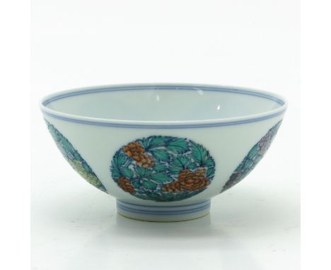 Depicting floral scenes, marked on bottom with double ring and 6 characters, 13 cm. in diameter. 